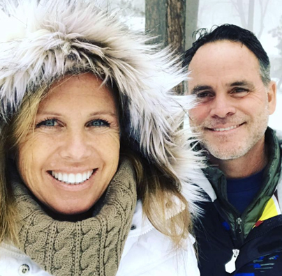 A man and woman smiling for the camera.